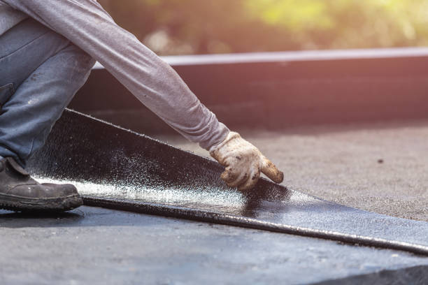 Professional Basement Waterproofing technician working in Arlington, NY